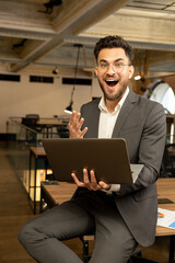 Young manager looking excited after receiving a good news