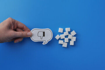 Stop Sugar Hand Holding Sign with Sugar Cubes