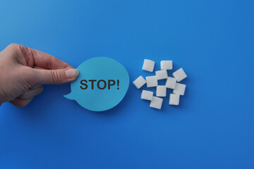 Stop Sugar Hand Holding Sign with Sugar Cubes