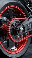 Close-up view of a sleek motorcycle rear wheel showcasing detailed chain and rim design