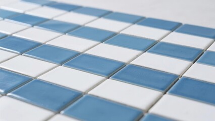 Blue and White Square Mosaic Tiles Arranged in a Grid Pattern