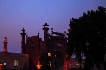 Twilight view of the majestic Badshahi Mosque in Lahore, Pakistan. Illuminated Mughal architecture...