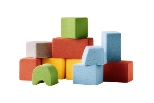Colorful, soft, square blocks in various sizes and colors, arranged in a stack and scattered