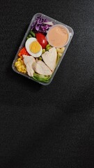 Suitable for food blogs, social media posts, and advertisements showcasing healthy eating habits and meal prep inspiration. Perfect for promoting fresh and convenient meal options.
