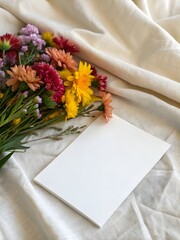 Blank Card with Colorful Flowers on Soft Fabric Background Mockup