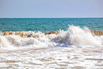 The ocean is calm and the waves are small