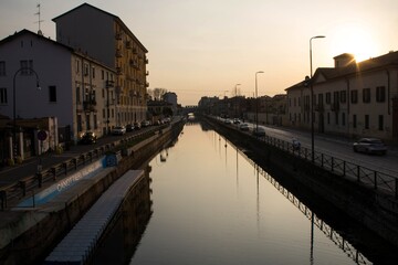 2022.03.19 Italy, Milan, Naviglio Grande: bohemian hangout of the city, image of the Naviglio at sunset