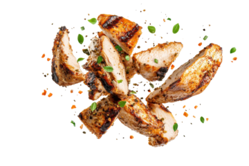 Grilled chicken strips with parsley and spices isolated on transparent background. Flying pieces of delicious grilled chicken isolated on white background.