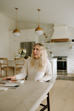 Smiling designer laughing while reviewing tile samples