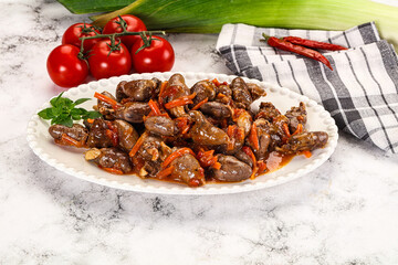 Baked chicken hearts with vegetables