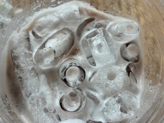 Ice Cubes in Glasses with Milk Foam – Refreshing Beverage Detail