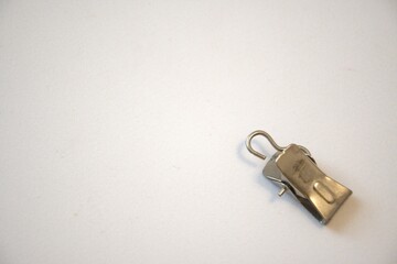 Curtain,Metal,Cut Out,Clamp,Textile,Copy Space,Shiny,Metal Clip,Holding,Home Interior,Indoors,Single Object,Hook - Equipment,Household Equipment,No People,Close-up,Steel,Equipment,Silver Colored