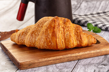 Fresh hot homemade croissant for breakfast