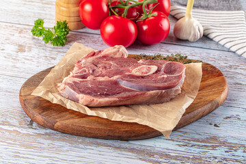 Raw lamb steak with bone