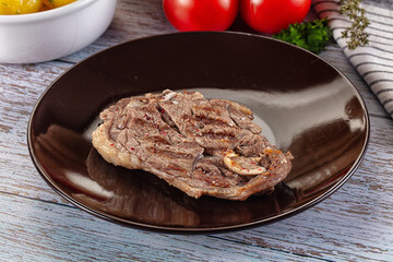 Grilled lamb steak with bone