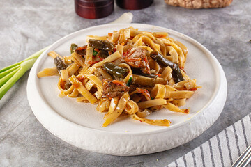 Asian cuisine udon with chicken and vegetables