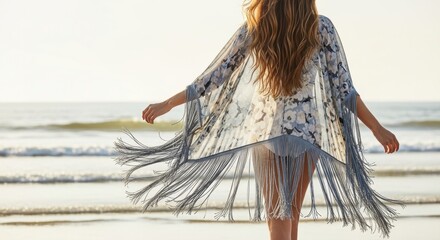 Young caucasian female enjoying beach in floral cover-up at sunset