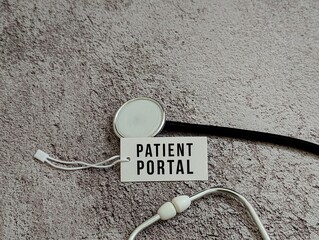 Flat lay of a stethoscope and a tag labeled Patient Portal on textured surface. Ideal for healthcare technology, medical communication, and online patient systems. medical, healthcare