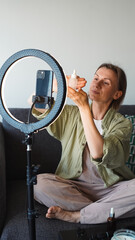 blogger takes out cosmetics from a plastic bag. Close-Up.  Soft focus