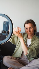 blogger takes out cosmetics from a plastic bag. Close-Up.  Soft focus