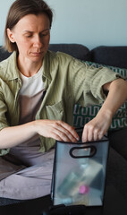 blogger takes out cosmetics from a plastic bag