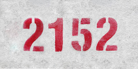 number 2152 . Red spray paint the white wall