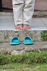 Child Standing Without Worn Sandals