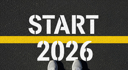 Start 2026: A striking ground-level perspective captures the word 'START' and the year '2026' stenciled boldly on a road surface. Evoking a sense of embarking, beginnings, and planning for the future.