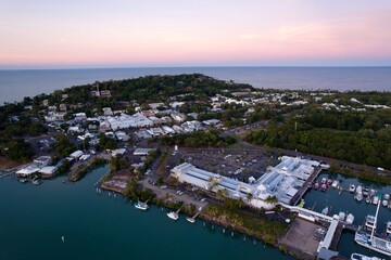 Aerial coastal town view at sunset with marina.