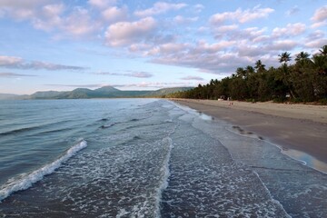 Tropical Beach with Palm Trees and Mountains