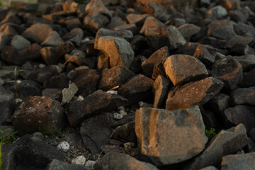 Pile of rough brown stones outdoors