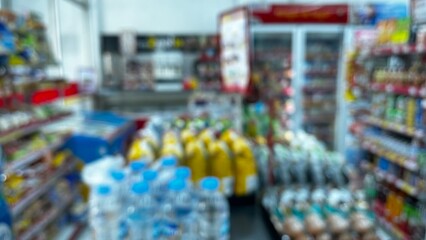 Abstract defocused background of a minimarket or convenience store. Blurred minimarket shop