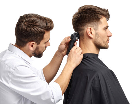 A barber trims a man's hair using electric clippers, both focused on the haircut against a black background.