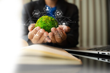 Business man using computer on CO2 emission reduction concept with global warming icon. along with...