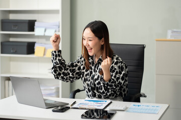 Overjoyed Asian woman celebrates a financial bonus. joyful smile, money success, and happiness...