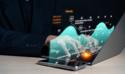 Person using a laptop with digital data charts and graphs projected, symbolizing analytics and technology integration.