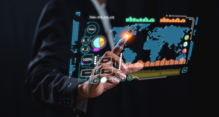A person interacts with a futuristic digital interface displaying global data, charts, and analytics in a high-tech business environment.