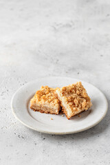 Lemon crumble bars on a plate on white background. Oatmeal lemon bar, text space