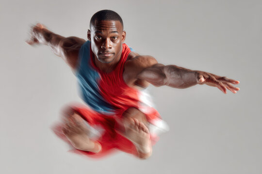 dynamic portrait of athlete performing double minitramp acrobatic trick emphasizing their facial expression