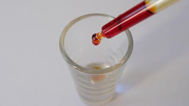 Iodine and iodide solution, slow motion. Lugol's iodine