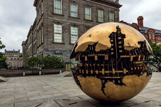 Arnaldo Pomodoro's Sphere Within Sphere sculpture outside the Berkeley Library at Trinity College in Dublin, Ireland