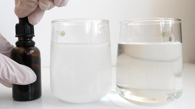 Iodine starch test in water. Water with and without starch. Water containing starch is turning color to black.