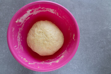 smooth kneaded dough resting in a mixing bowl