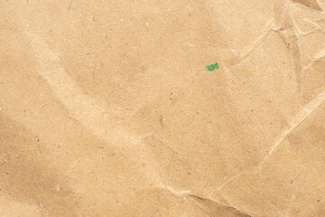 Abstract crumpled and creased recycle brown paper texture background