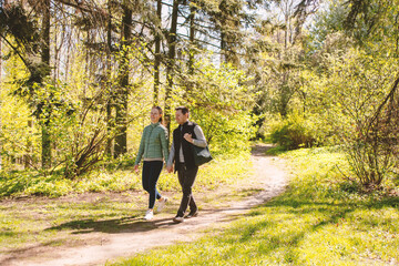 Couple Walking in a Sunny Spring Forest