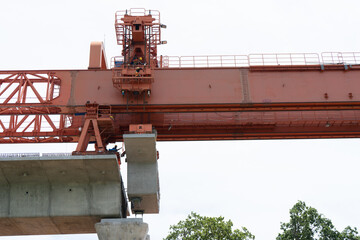 Workers construct bridge piers for a railway.