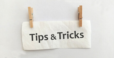 tips and tricks sign on white background	