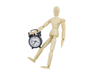 Symbol of Time: Wooden Figure Standing Beside a Clock Representing Urgency and Discipline