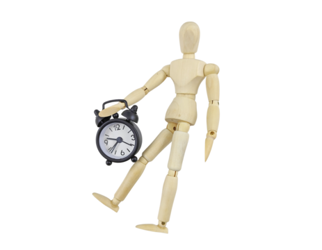 Symbol of Time: Wooden Figure Standing Beside a Clock Representing Urgency and Discipline