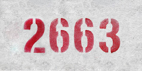 red spray-painted number 2663 sprayed onto a white wall.